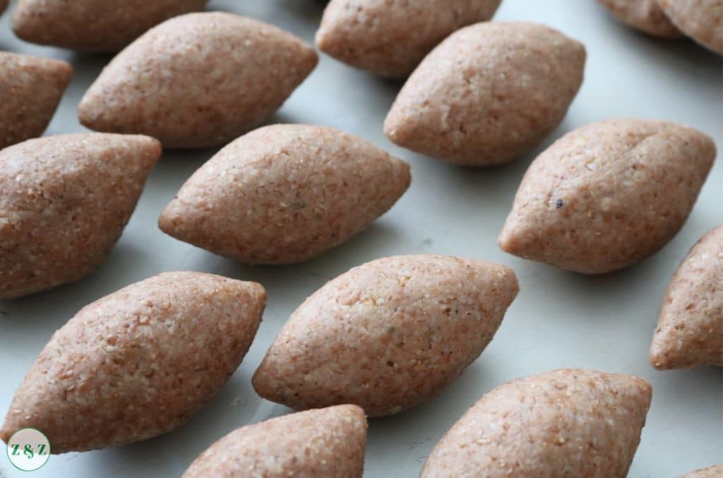 Raw kibbe on a tray ready to be fried