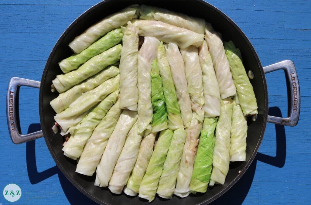 Roll and stack the cabbage rolls in a pot