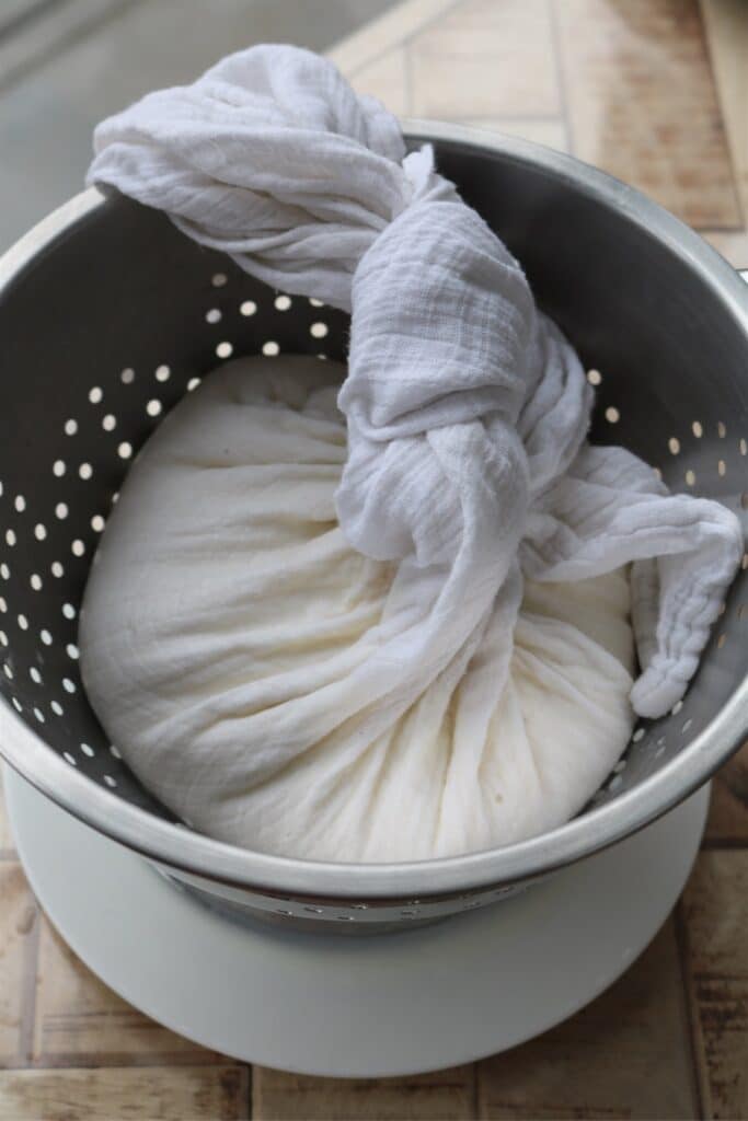 muslin cloth in colander